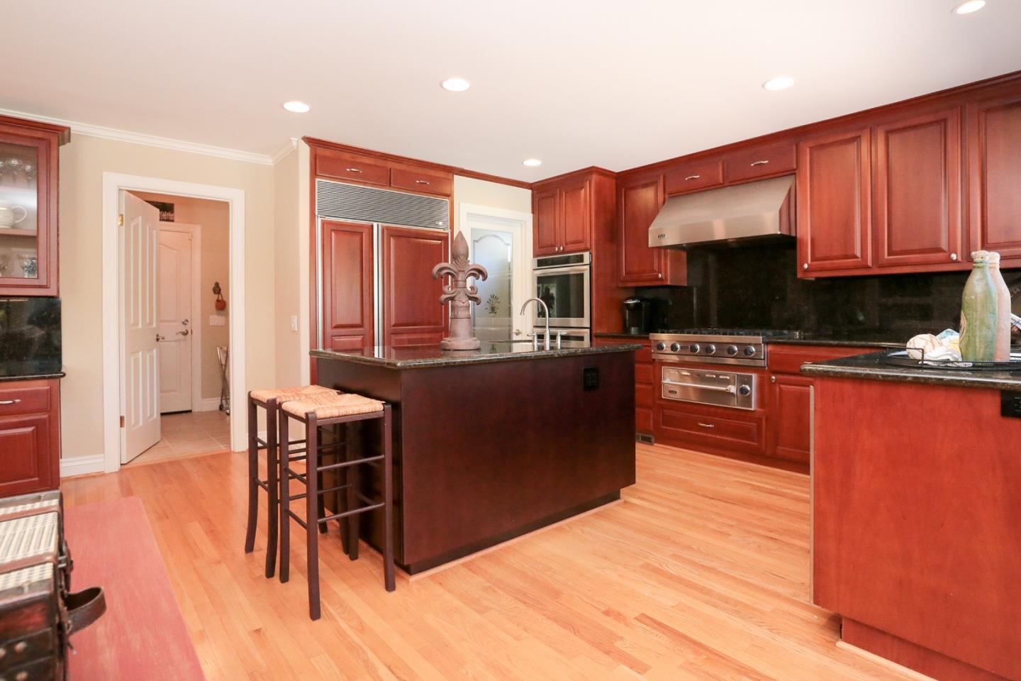 1068 Audrey Avenue Campbell, CA 95008 - Photo 9 of 47 a kitchen with stainless steel appliances kitchen island granite countertop a stove a sink and a microwave