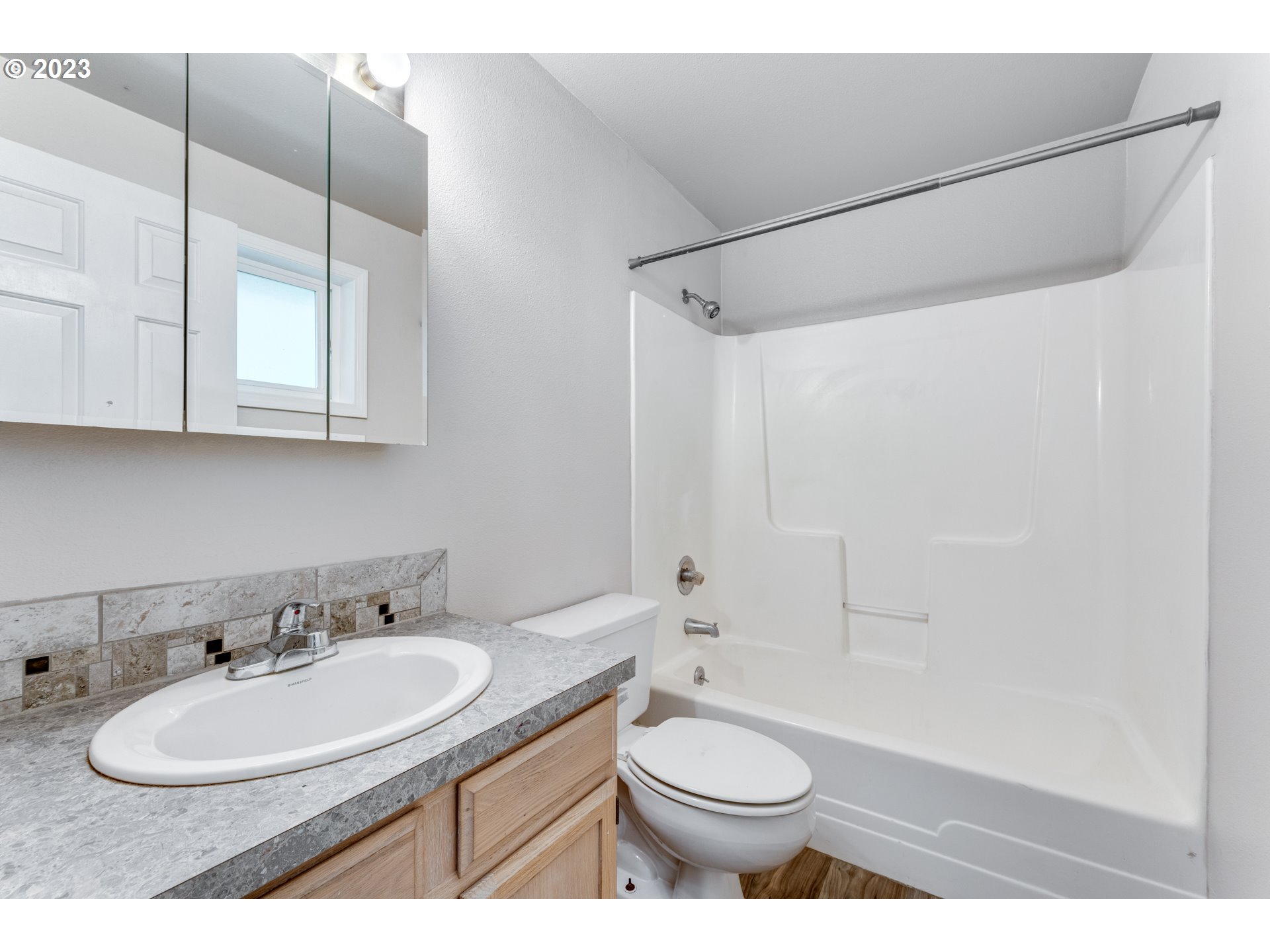 206 South 8th Avenue Ridgefield, WA 98642 - Photo 12 of 22 a bathroom with a sink toilet and shower
