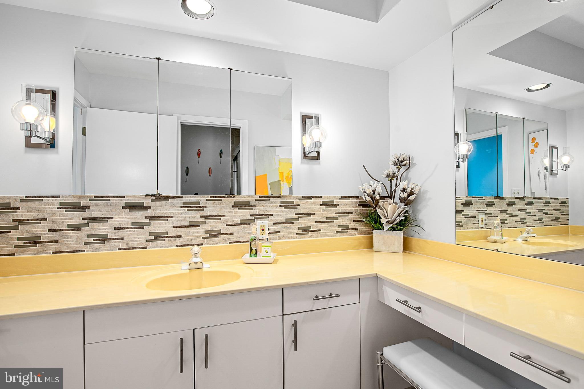 26282 Deep Water Harbor Road Easton, MD 21601 - Photo 28 of 53 a bathroom with a granite countertop sink and a mirror