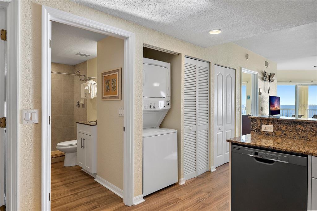 12000 Gulf Boulevard, Unit 501W Treasure Island, FL 33706 - Photo 14 of 36 a bathroom with a granite countertop sink a toilet and shower