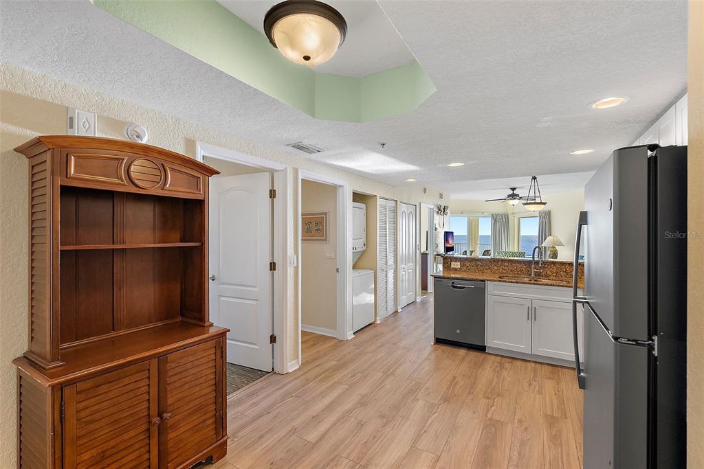 12000 Gulf Boulevard, Unit 501W Treasure Island, FL 33706 - Photo 15 of 36 a kitchen with a refrigerator and a wooden floor
