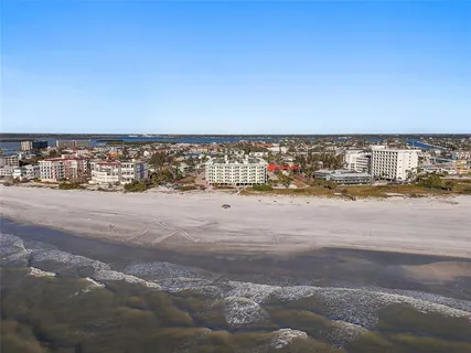 a view of a swimming pool with a table and chairs