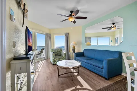 a view of a livingroom with furniture and wooden floor