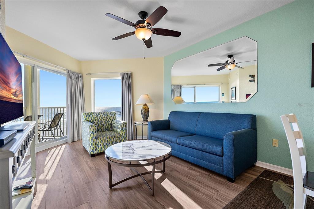 12000 Gulf Boulevard, Unit 501W Treasure Island, FL 33706 - Photo 9 of 36 a living room with furniture and a wooden floor