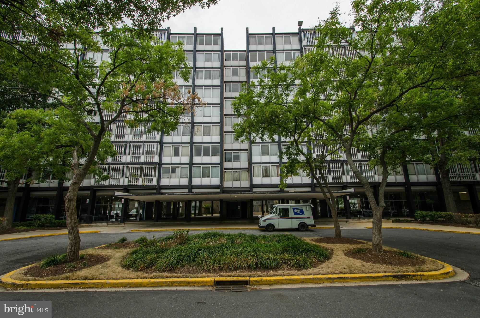 1301 Delaware Avenue Southwest, Unit N523 Washington, DC 20024 - Photo 3 of 26 a large building with a sign board