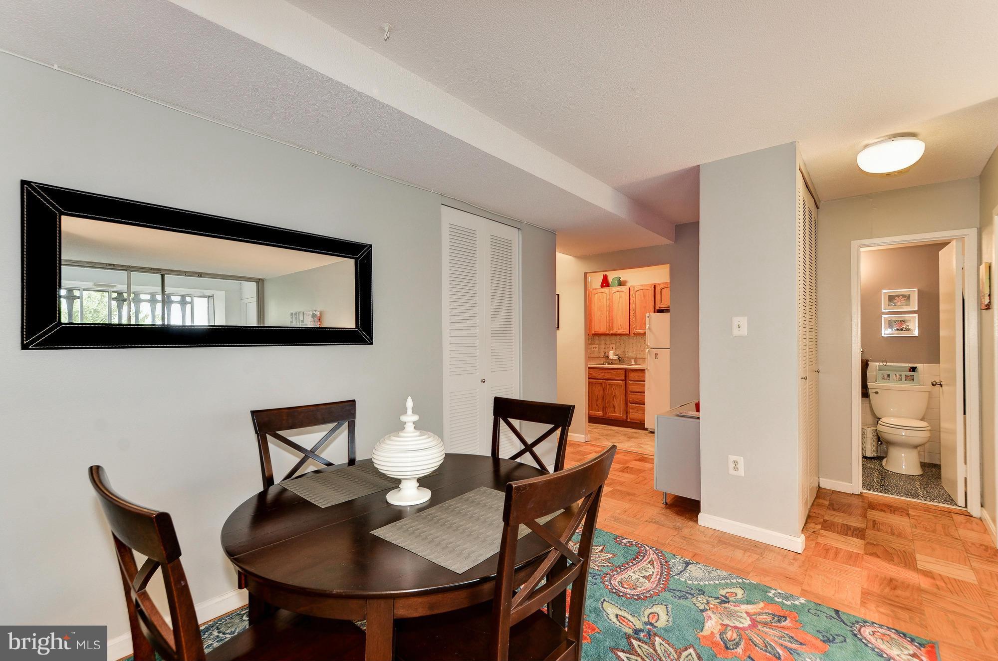 1301 Delaware Avenue Southwest, Unit N523 Washington, DC 20024 - Photo 10 of 26 a view of a dining room with furniture