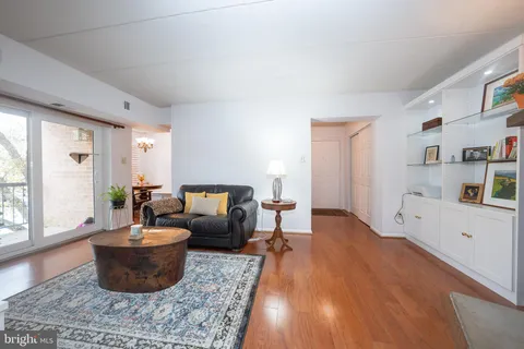 a view of a livingroom with an empty space and a window