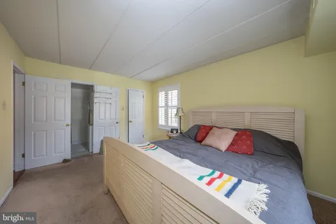 a view of walk in closet with clothes