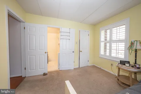 a bathroom with a sink toilet and mirror