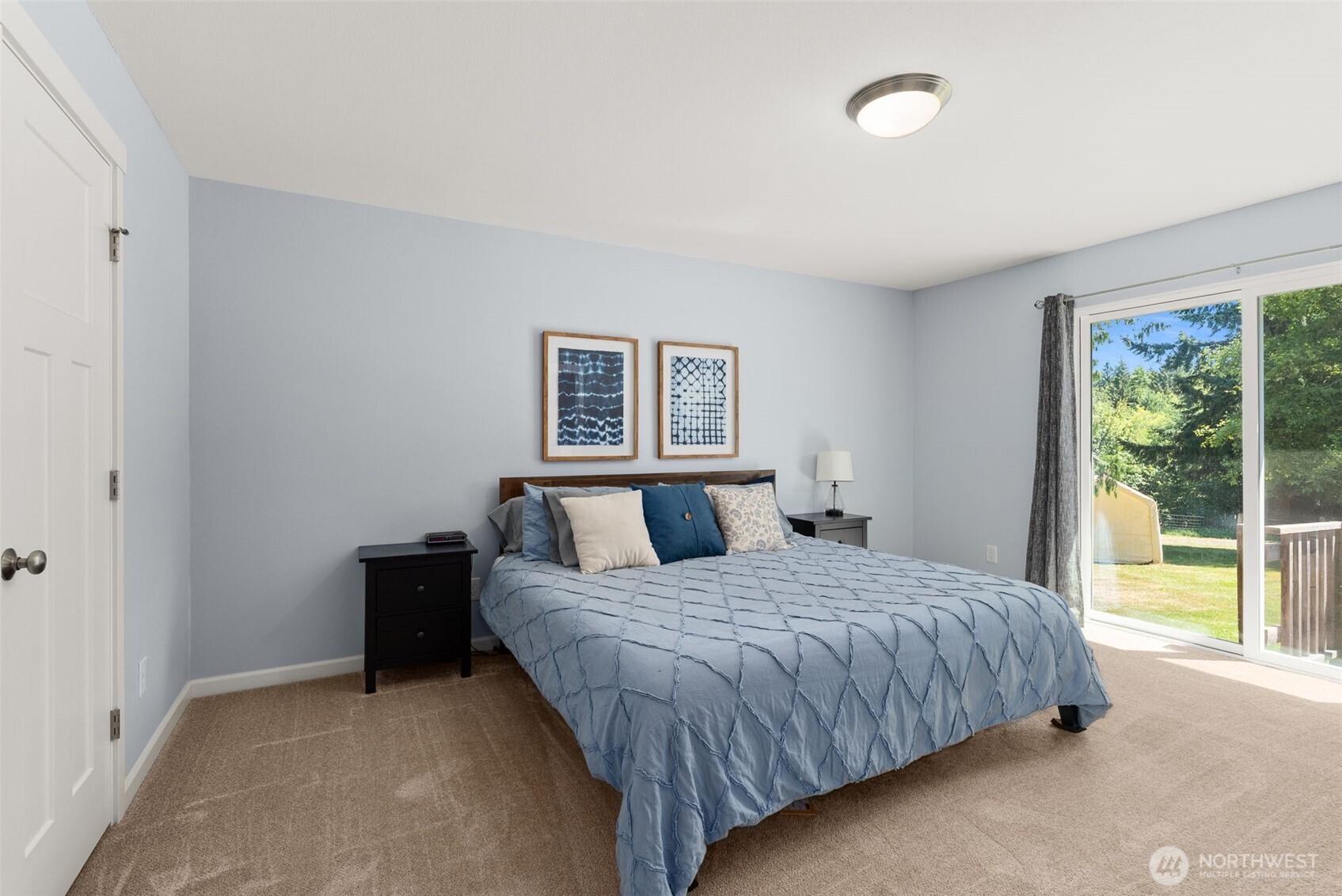 317 Cousins Road Chehalis, WA 98532 - Photo 14 of 40 a bedroom with a large bed and a window