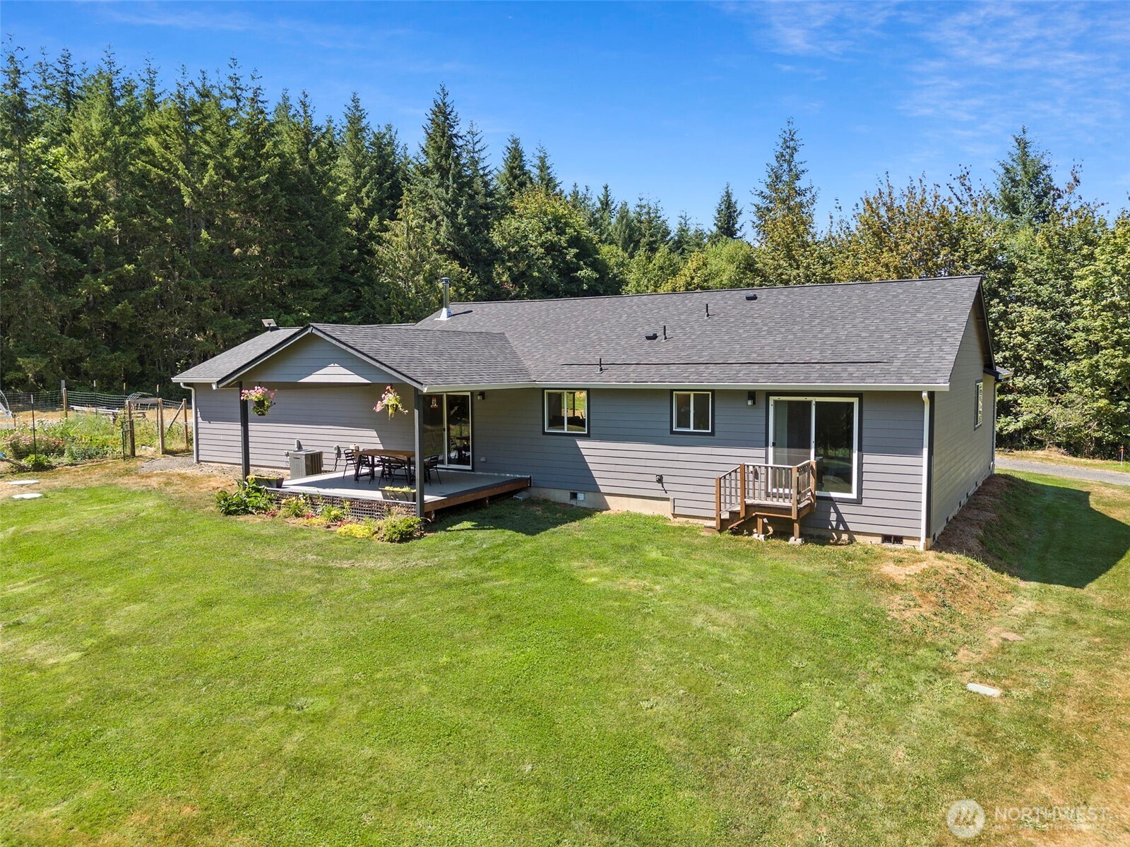 317 Cousins Road Chehalis, WA 98532 - Photo 25 of 40 a view of house with garden and trees