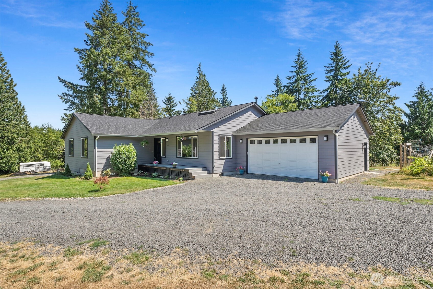 317 Cousins Road Chehalis, WA 98532 - Photo 3 of 40 a front view of a house with a yard and a garage