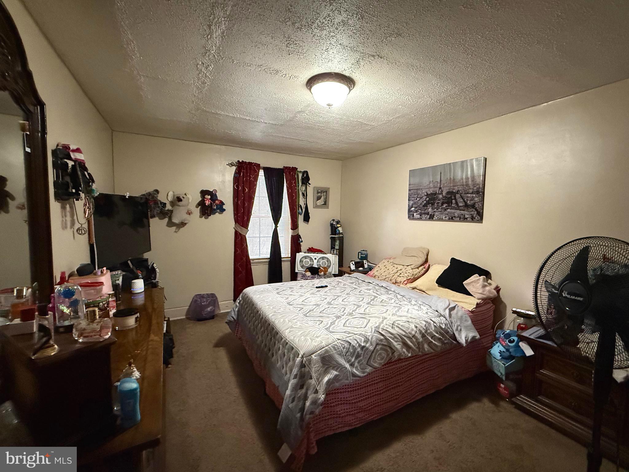 1623 Olympia Road Camden, NJ 08104 - Photo 11 of 23 a bedroom with bed mirror and on the dresser