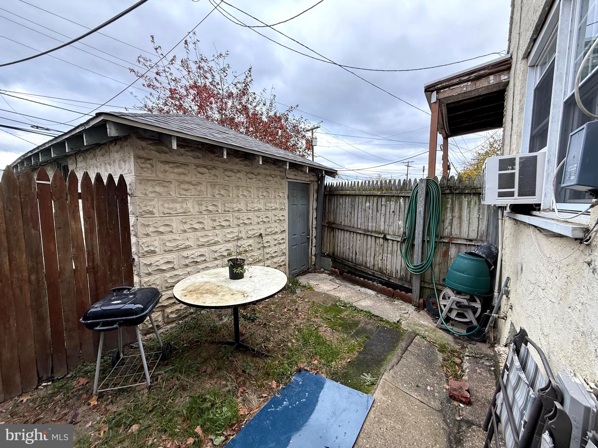 1623 Olympia Road Camden, NJ 08104 - Photo 19 of 23 a backyard of a house with table and chairs
