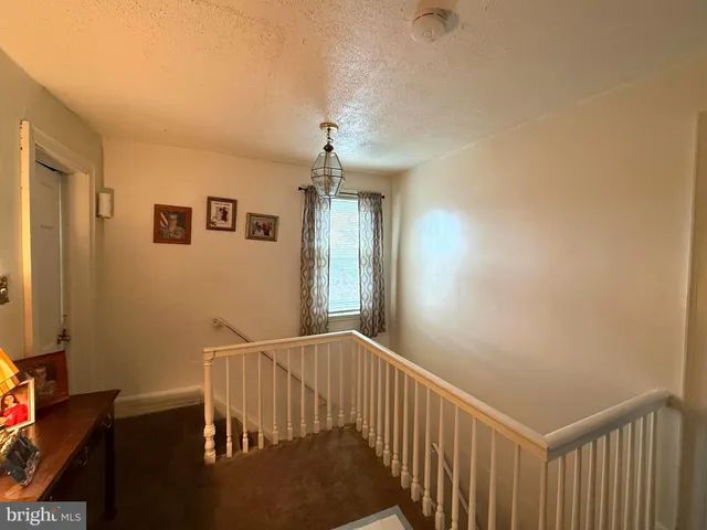 a view of a hallway with workspace