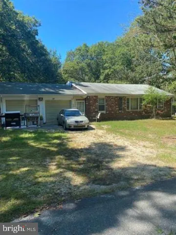 a view of a swimming pool with a yard