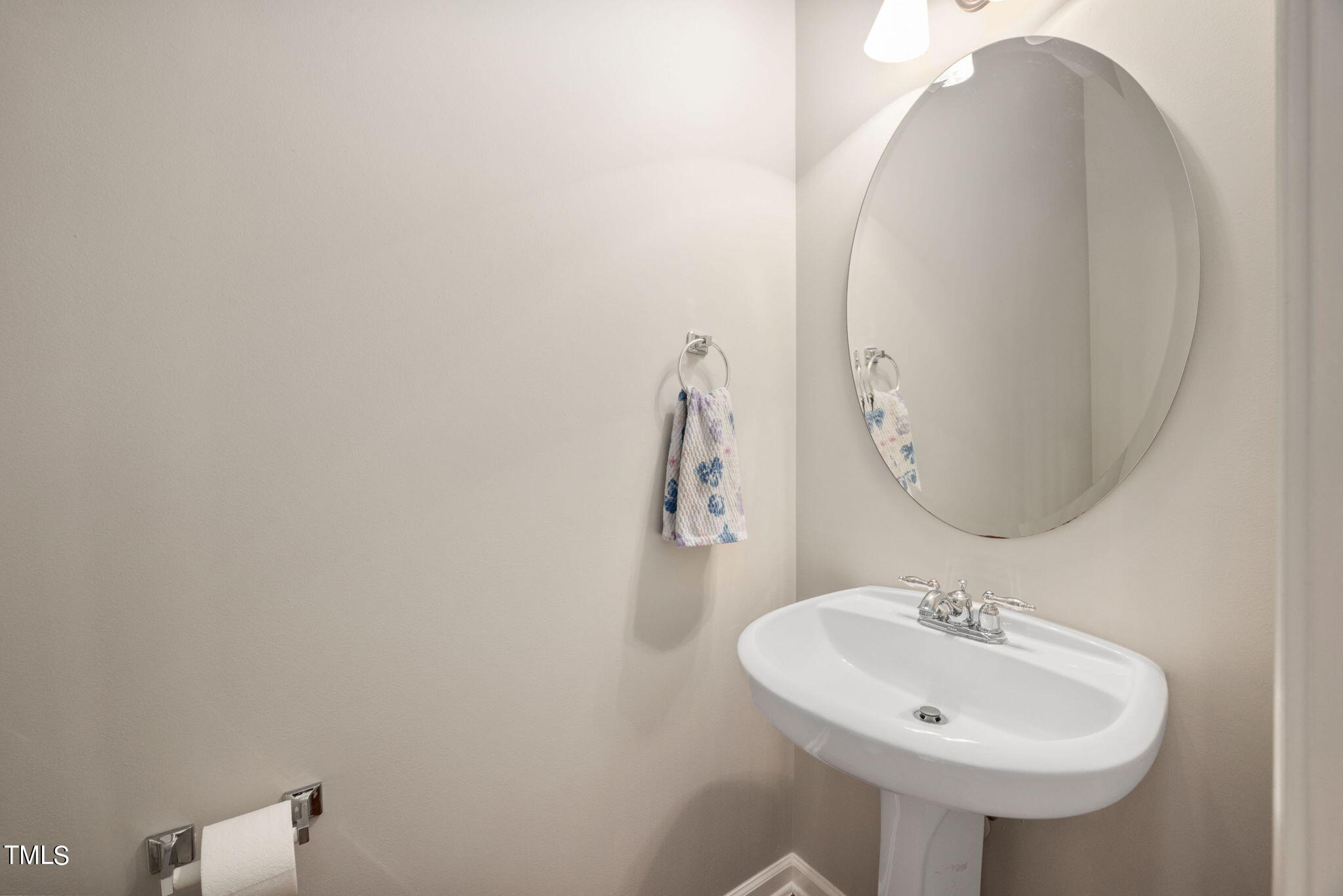 8620 Benzinger Drive Raleigh, NC 27613 - Photo 17 of 51 a bathroom with a sink and a mirror