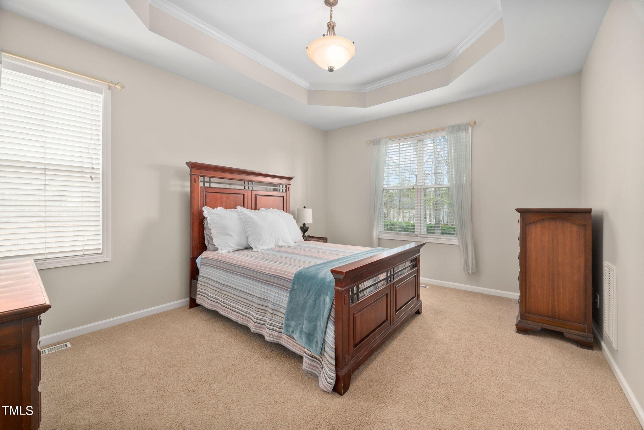 8620 Benzinger Drive Raleigh, NC 27613 - Photo 18 of 51 a bed room with a bed and a window