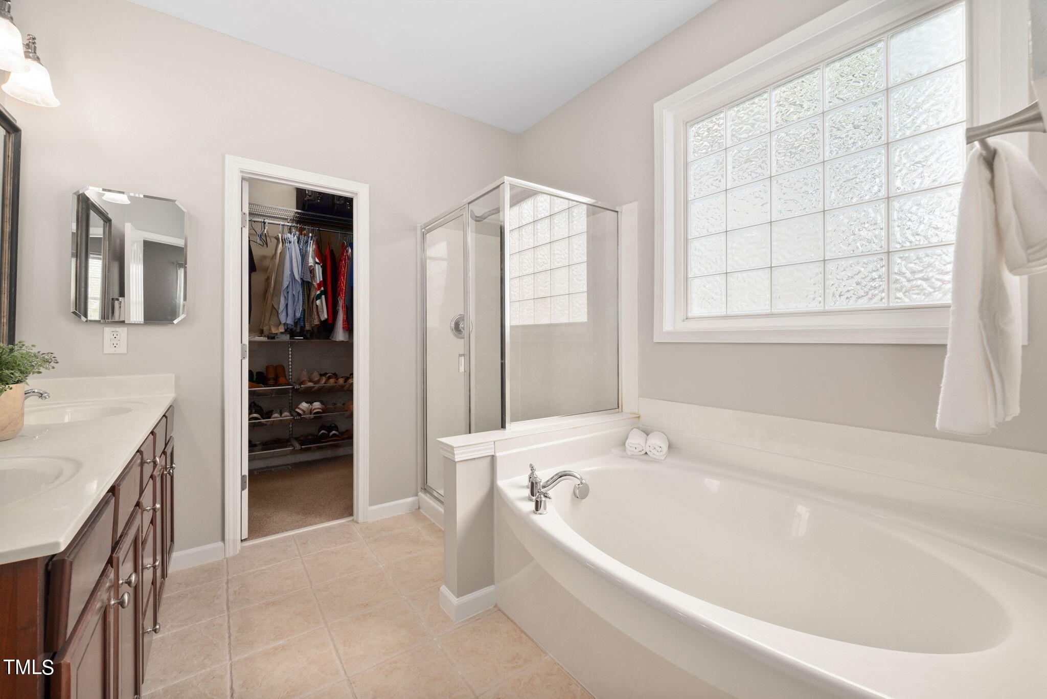 8620 Benzinger Drive Raleigh, NC 27613 - Photo 21 of 51 a bathroom with a bathtub and a sink
