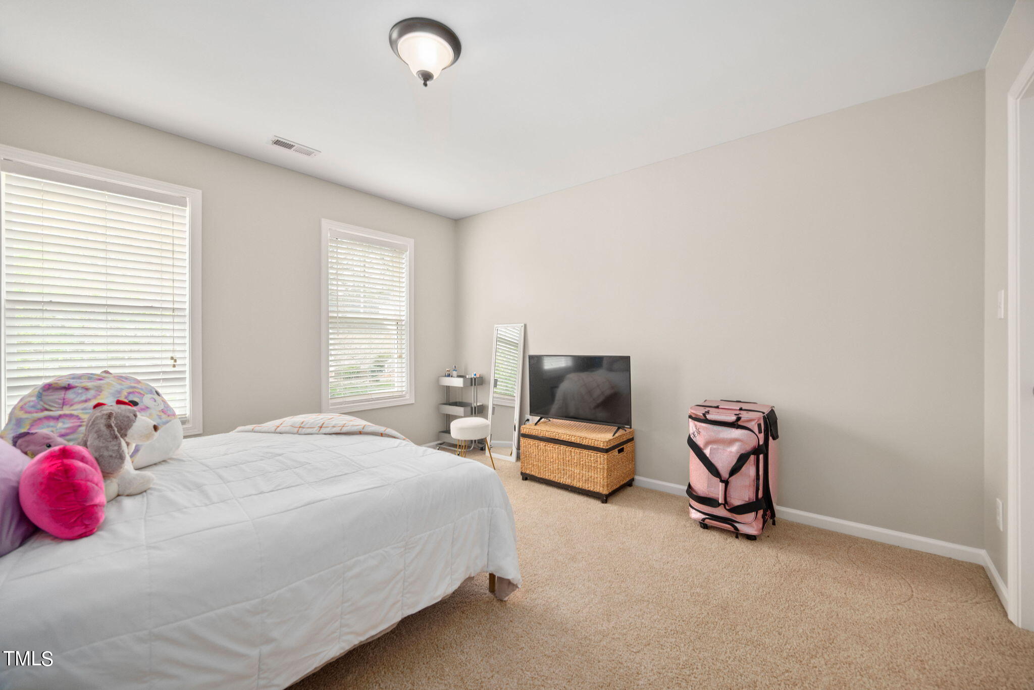 8620 Benzinger Drive Raleigh, NC 27613 - Photo 27 of 51 a bedroom with a bed chair and window