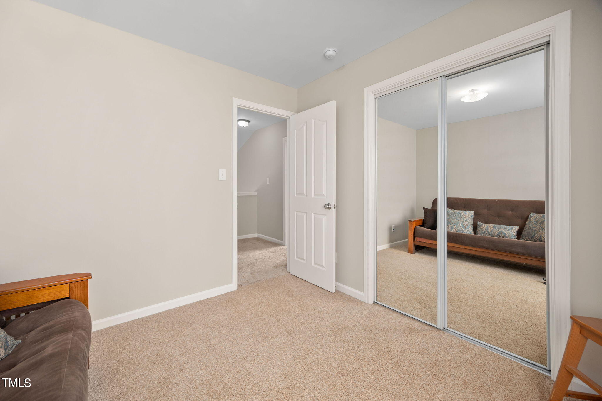 8620 Benzinger Drive Raleigh, NC 27613 - Photo 31 of 51 a view of a livingroom with furniture and a flat screen tv