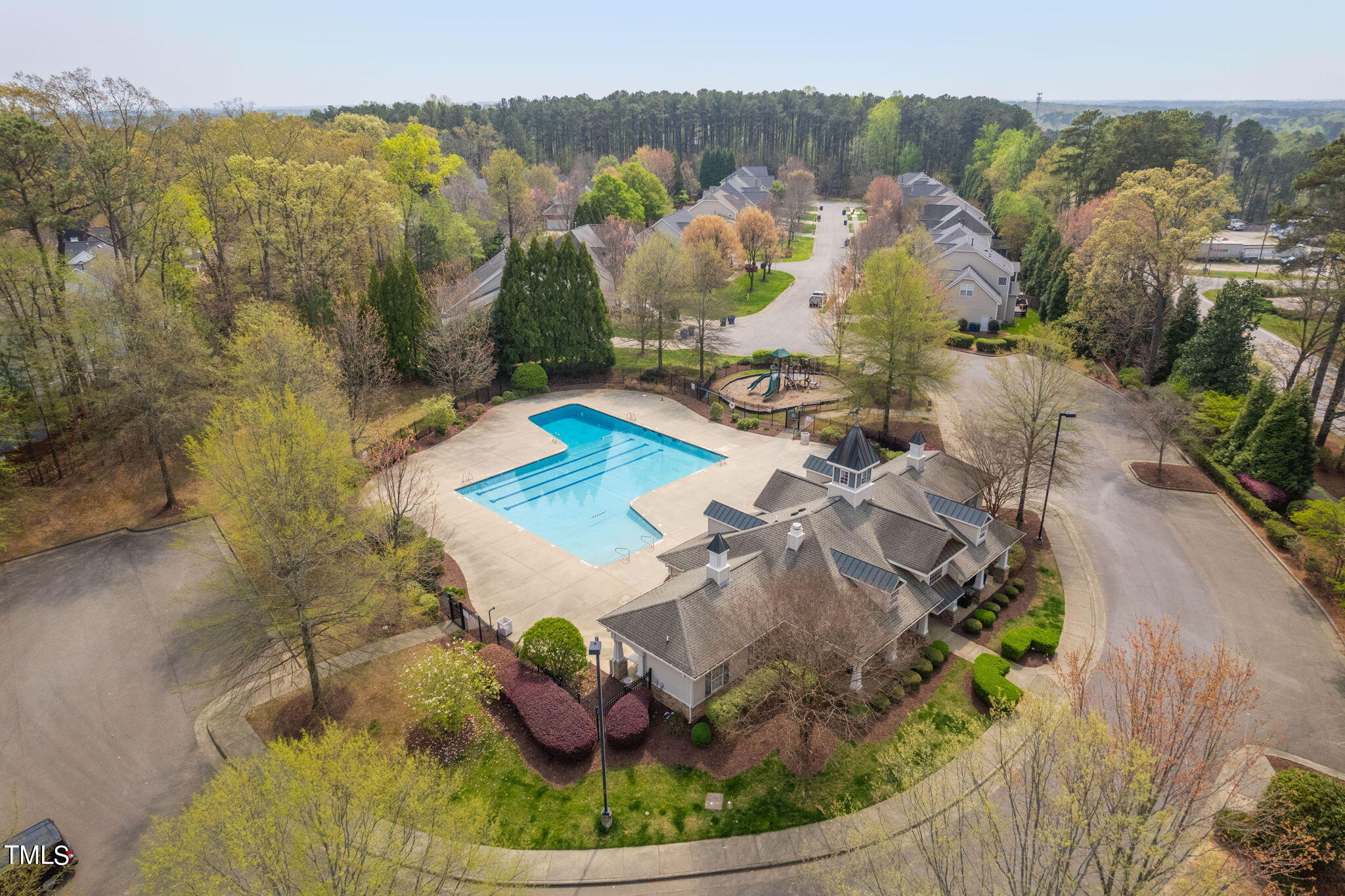 8620 Benzinger Drive Raleigh, NC 27613 - Photo 50 of 51 a view of a swimming pool with a yard