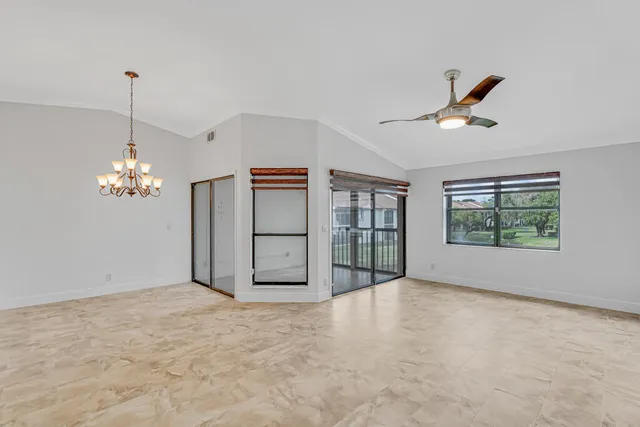 a spacious bathroom with a granite countertop sink a mirror and a