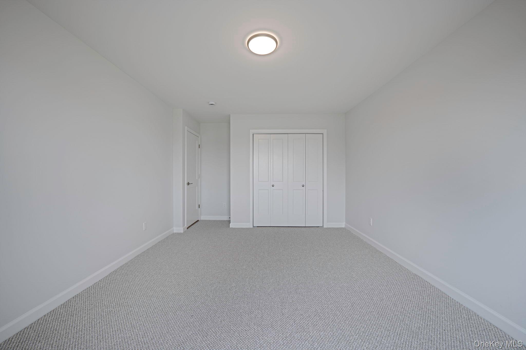 115 Riviera Parkway Lindenhurst, NY 11757 - Photo 15 of 33 Unfurnished bedroom with carpet flooring and a closet