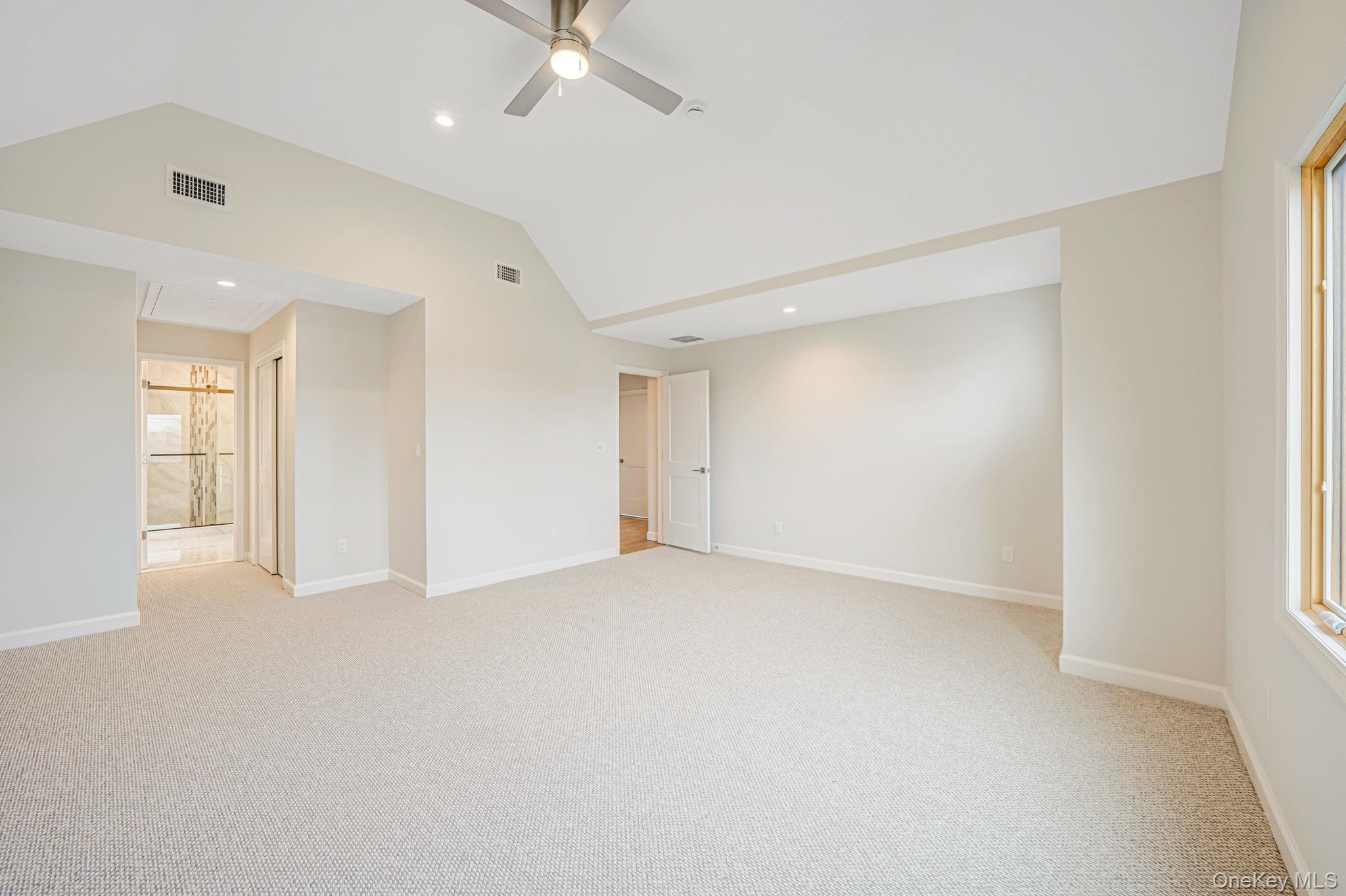 115 Riviera Parkway Lindenhurst, NY 11757 - Photo 10 of 33 Empty room with lofted ceiling, light carpet, recessed lighting, and a ceiling fan