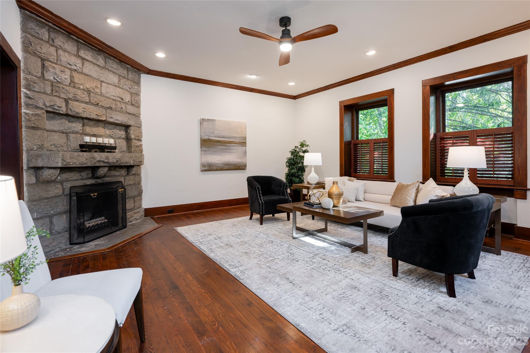 27 Edgewood Road Asheville, NC 28804 - Photo 12 of 48 a living room with furniture a large window and a fireplace