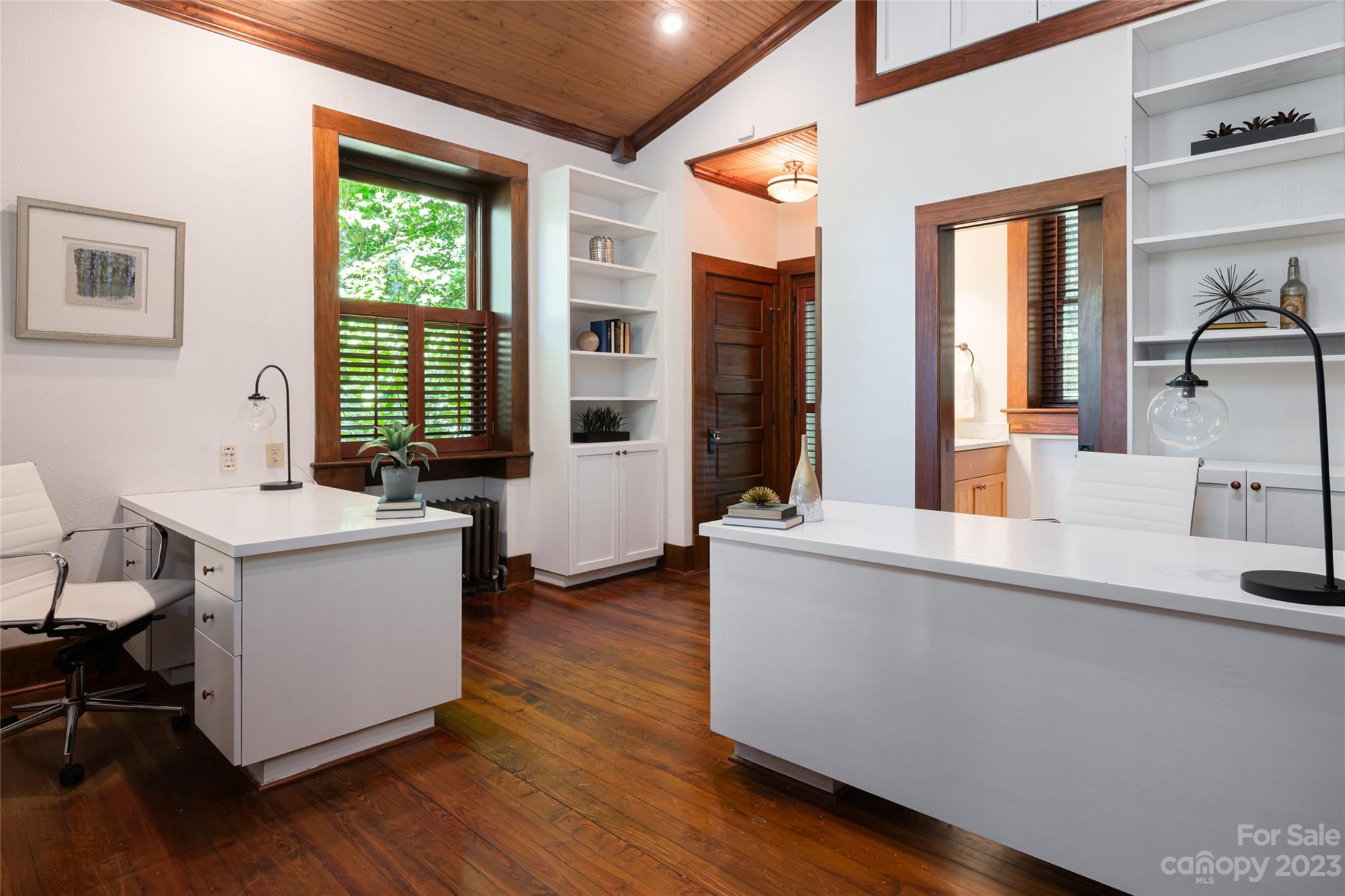 27 Edgewood Road Asheville, NC 28804 - Photo 26 of 48 a living room with a kitchen island furniture with wooden floor and a large window
