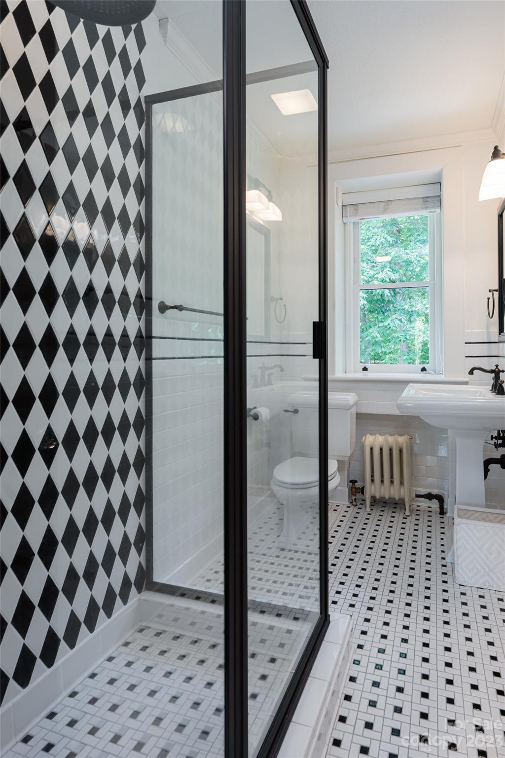 27 Edgewood Road Asheville, NC 28804 - Photo 35 of 48 a bathroom with a black and white checkered floor