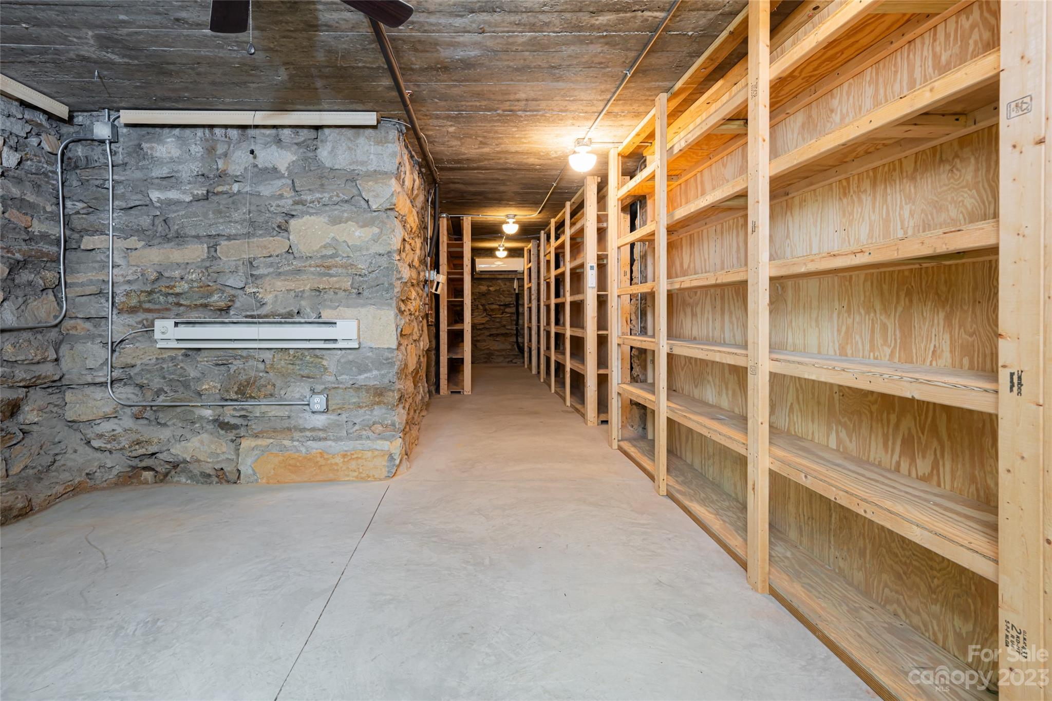 27 Edgewood Road Asheville, NC 28804 - Photo 37 of 48 a view of walk in closet with empty racks