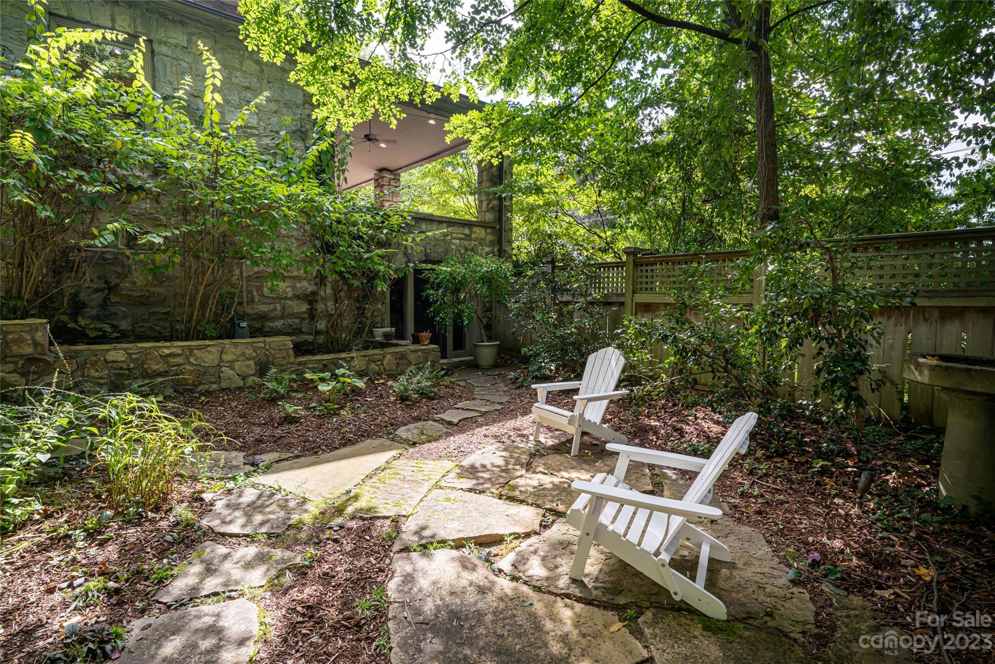 27 Edgewood Road Asheville, NC 28804 - Photo 46 of 48 a view of a chairs and table in backyard
