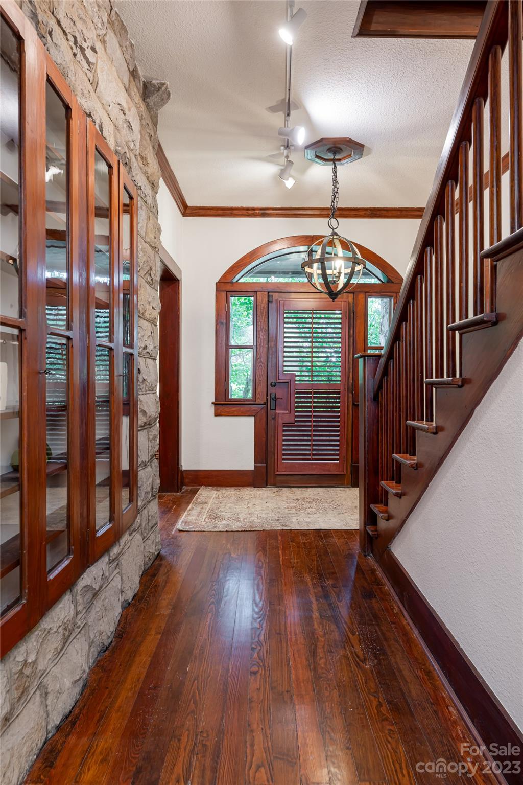 27 Edgewood Road Asheville, NC 28804 - Photo 9 of 48 a view of empty room with wooden floor and fan