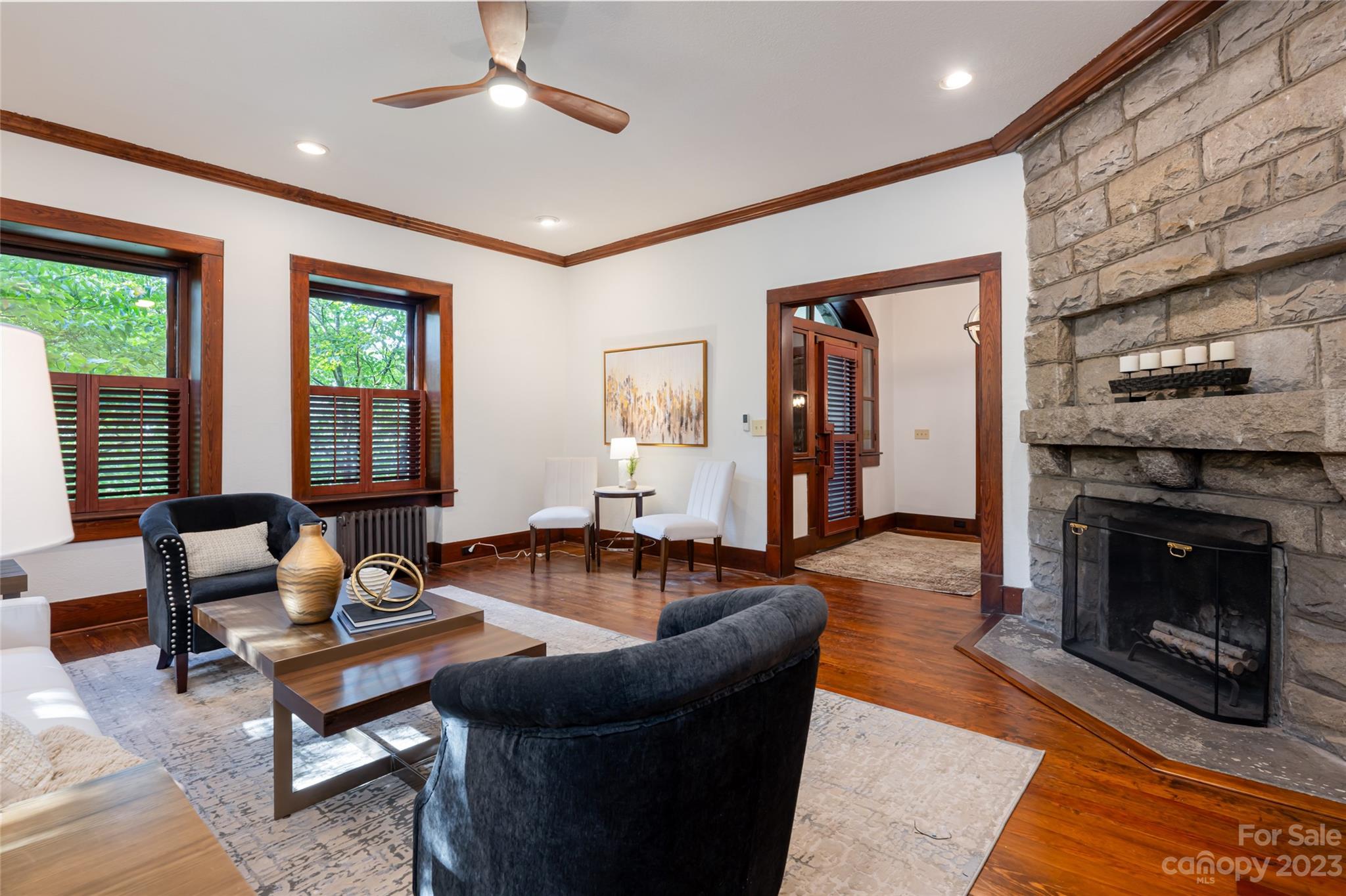 27 Edgewood Road Asheville, NC 28804 - Photo 10 of 48 a living room with furniture a fireplace and a table