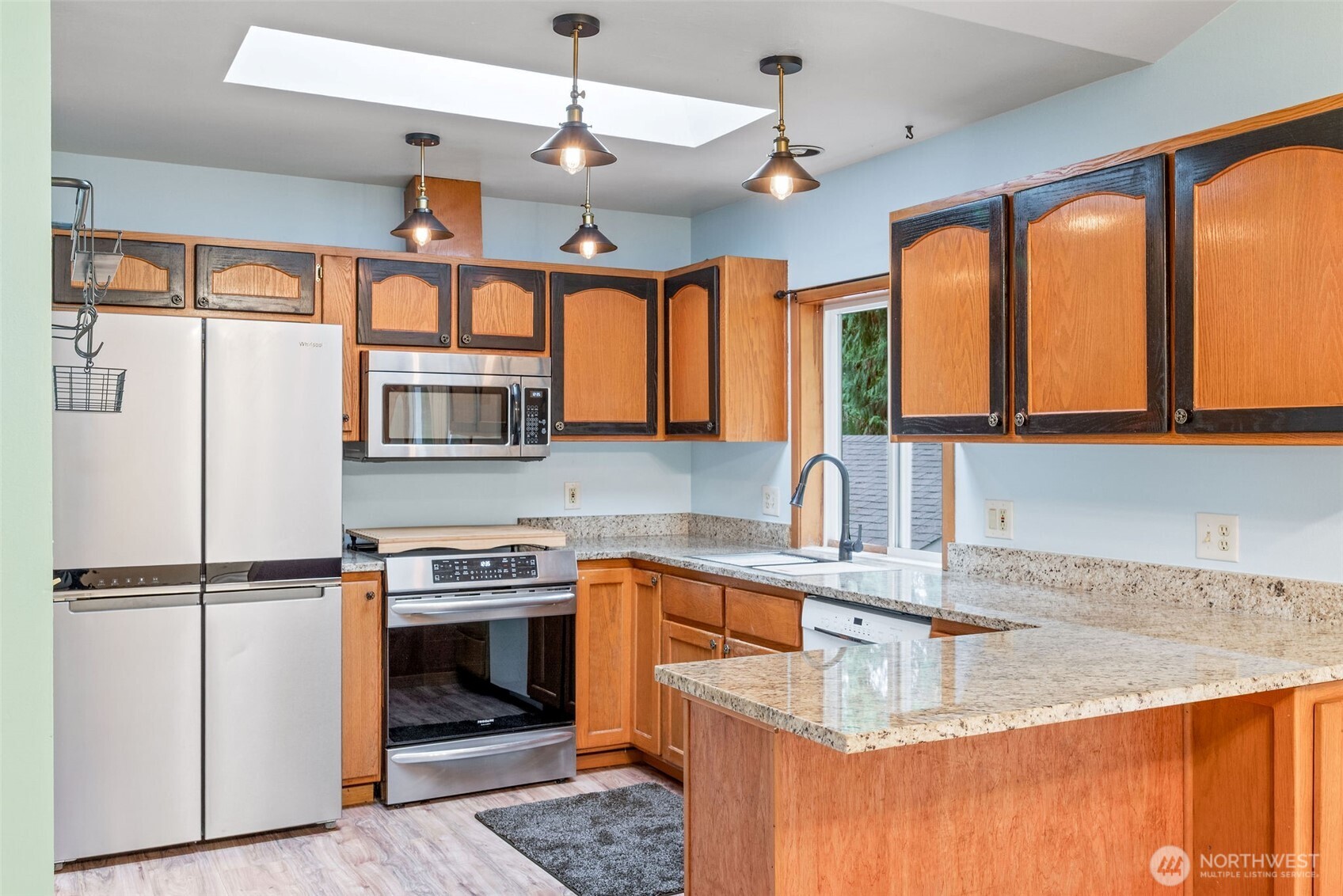 38 Brighton Street Port Hadlock, WA 98339 - Photo 17 of 37 a kitchen with stainless steel appliances granite countertop a sink a stove and a refrigerator