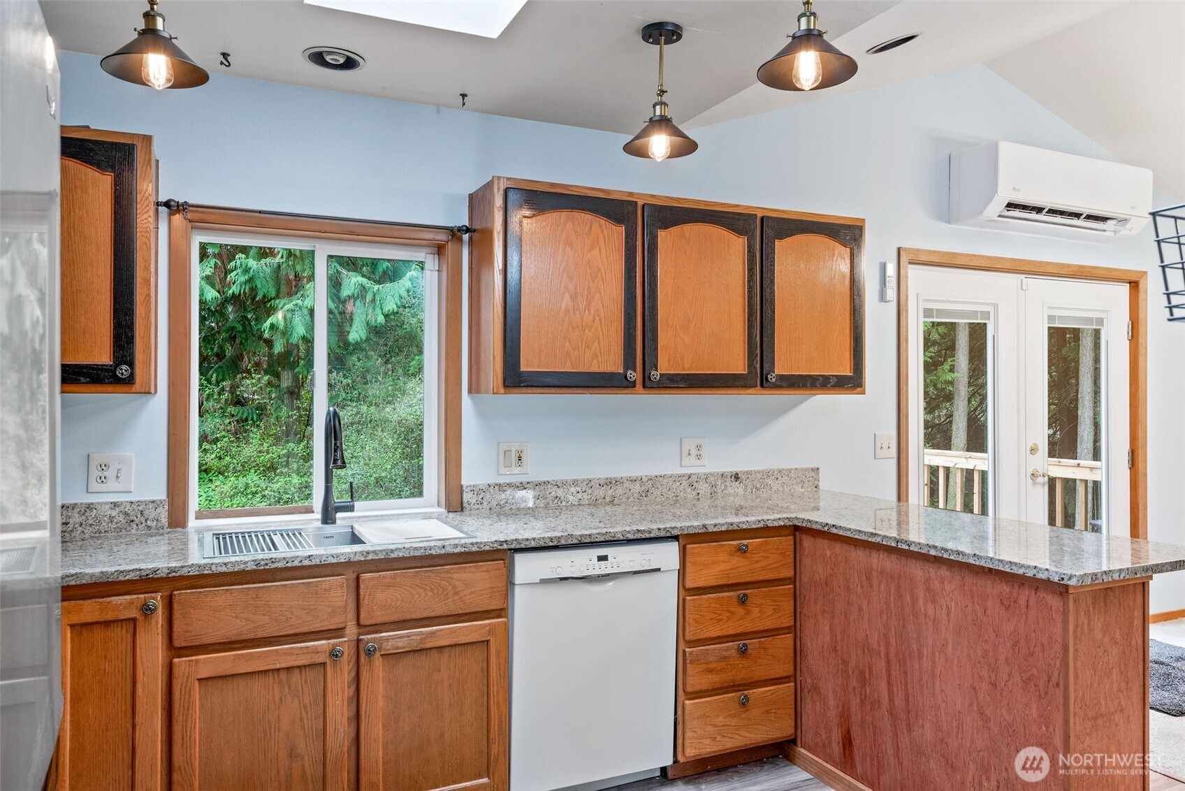 38 Brighton Street Port Hadlock, WA 98339 - Photo 18 of 37 a kitchen with stainless steel appliances granite countertop a stove a sink and a granite counter tops with large windows