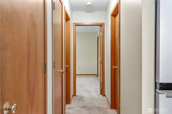 a view of a bathroom with a glass door and shower