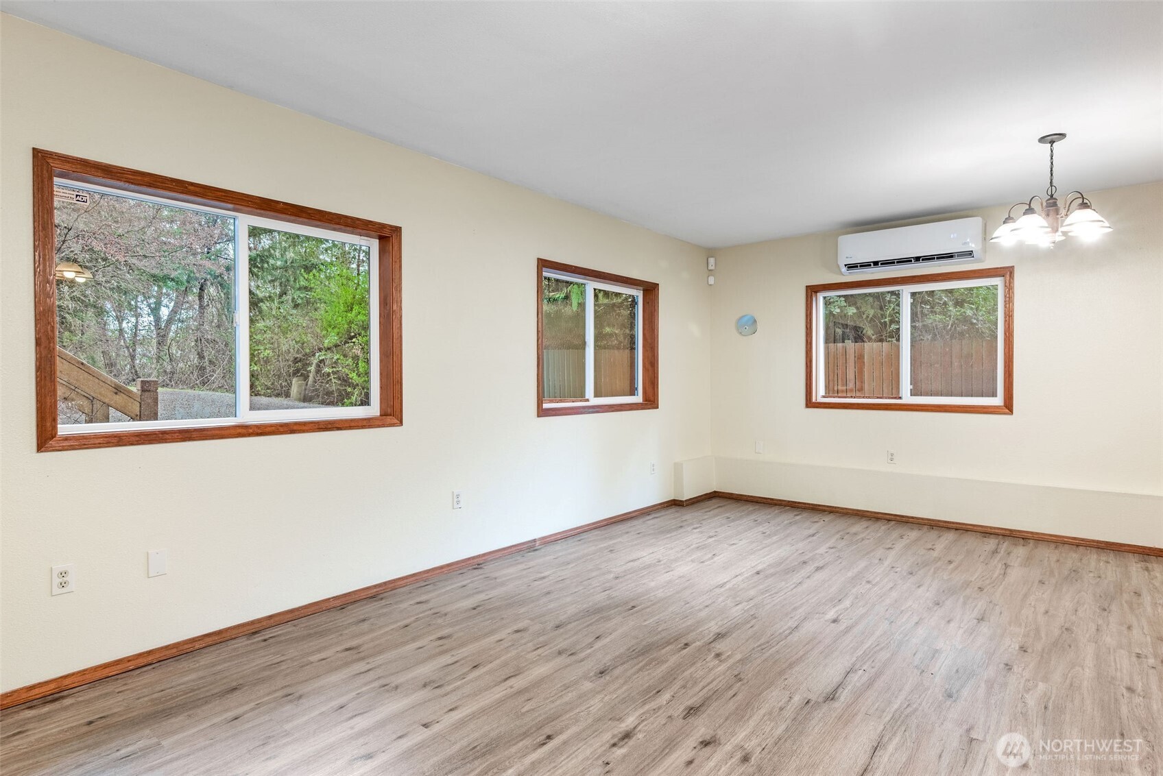 38 Brighton Street Port Hadlock, WA 98339 - Photo 29 of 37 a view of an empty room with wooden floor and a window