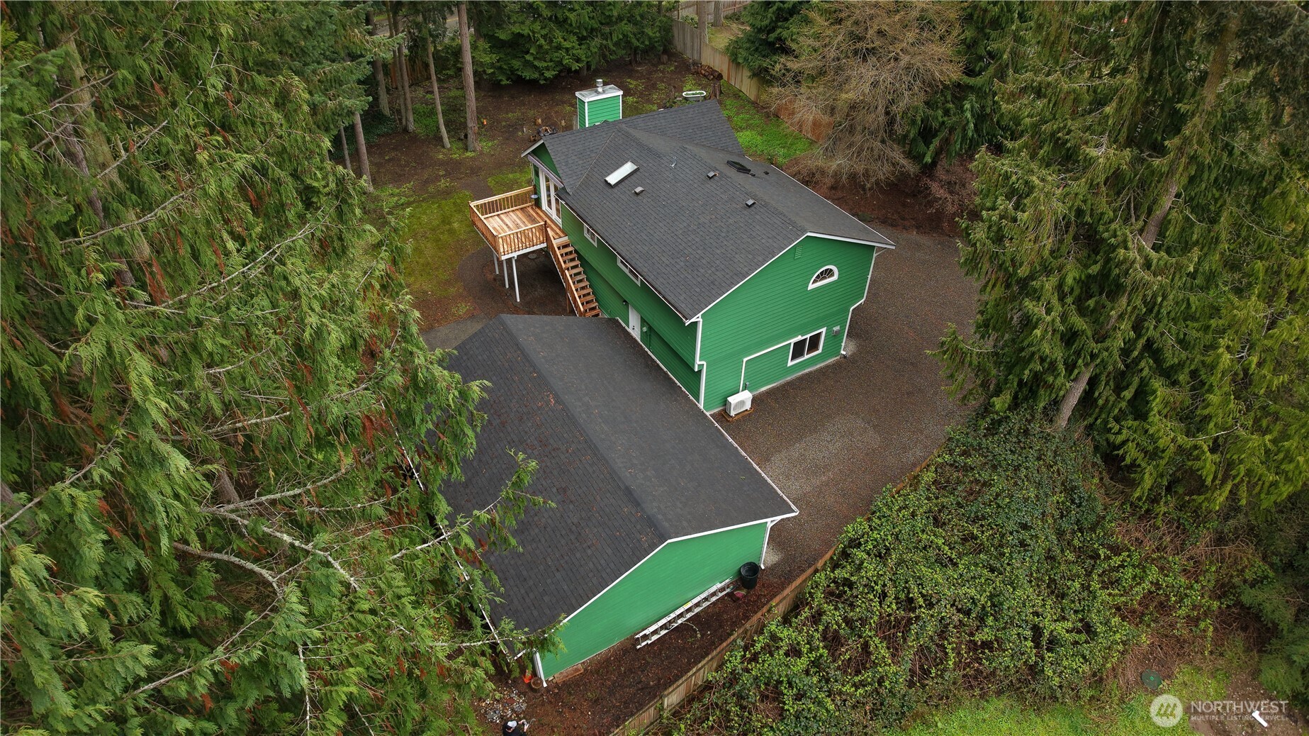 38 Brighton Street Port Hadlock, WA 98339 - Photo 7 of 37 an aerial view of a house with a yard and trees all around