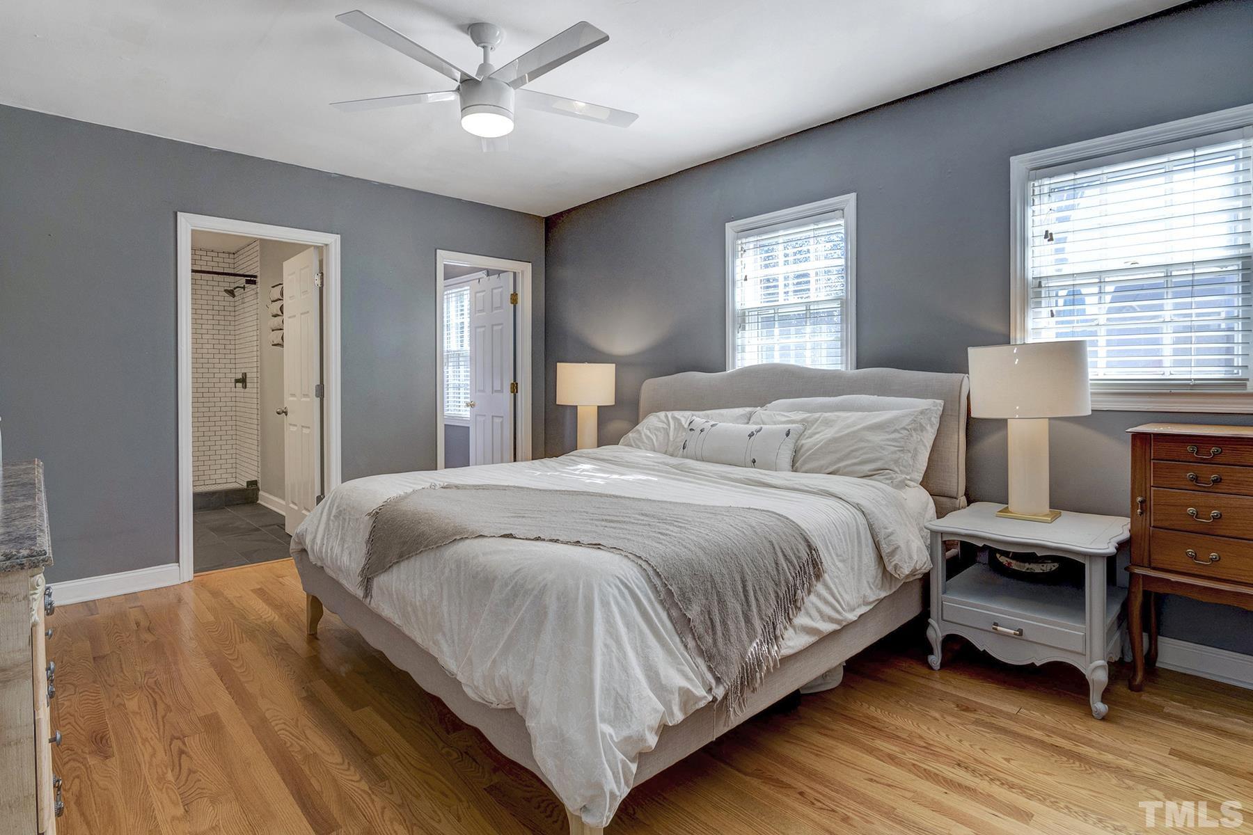 224 Glascock Street Raleigh, NC 27604 - Photo 15 of 28 a bedroom with a bed wooden floor and window