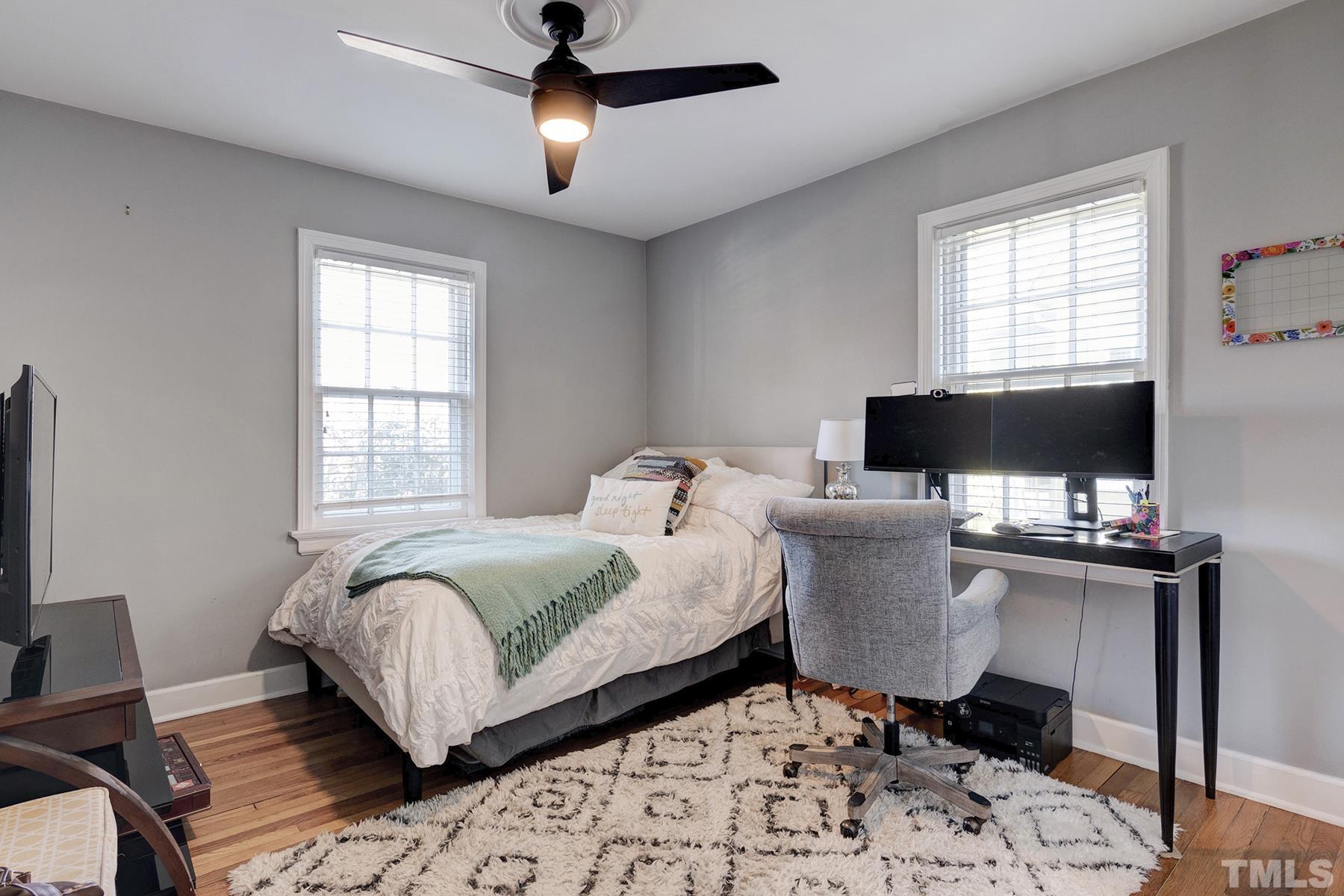 224 Glascock Street Raleigh, NC 27604 - Photo 23 of 28 a bed room with a bed and a window