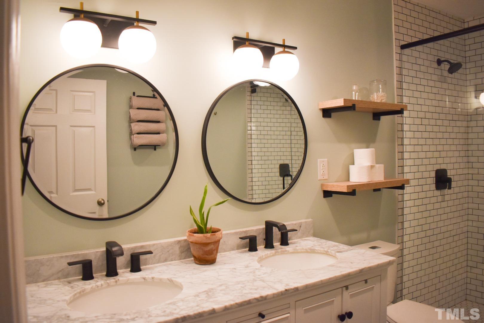 224 Glascock Street Raleigh, NC 27604 - Photo 5 of 28 an outdoor bathroom with a sink and a mirror
