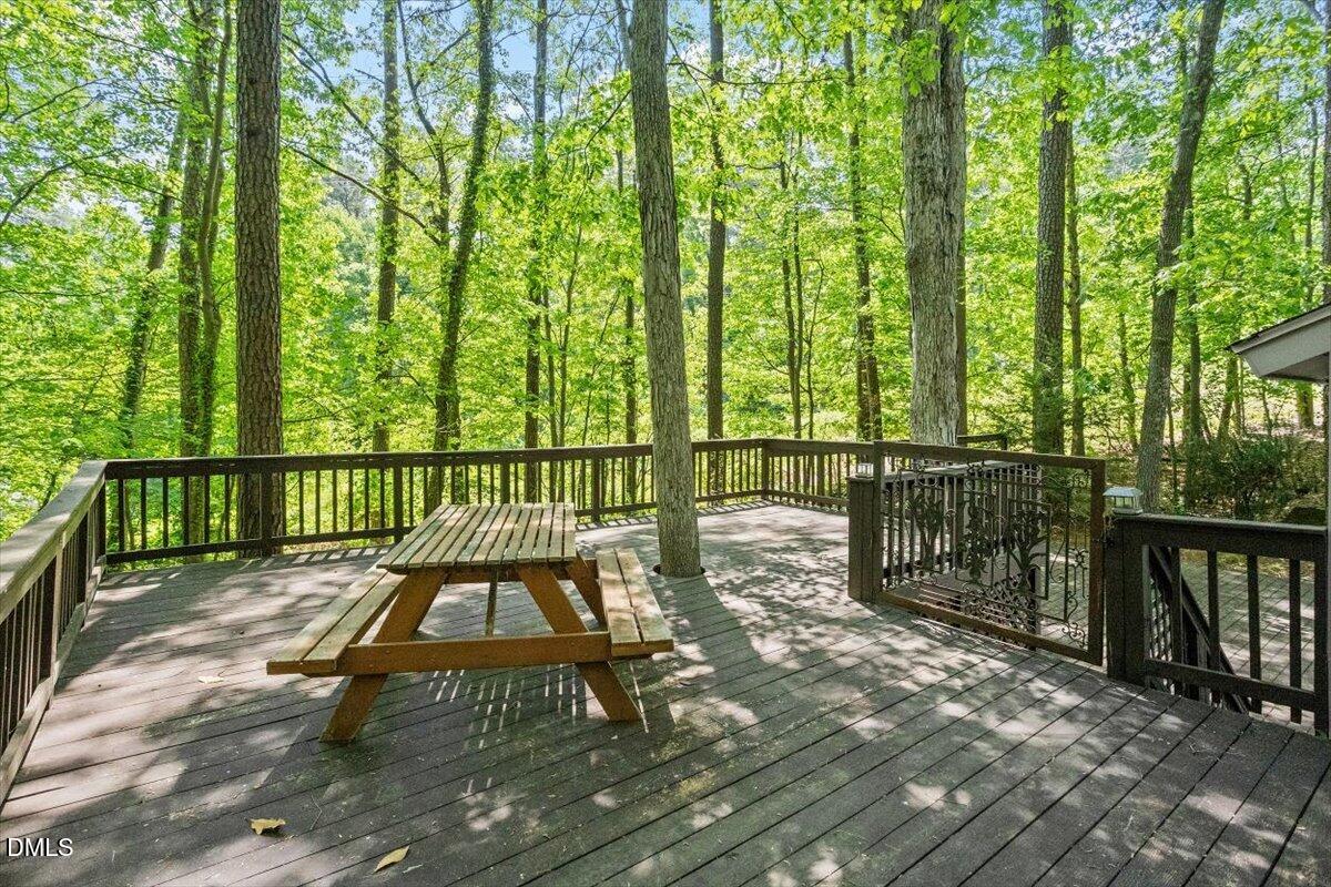 1405 Fairway Ridge Drive Raleigh, NC 27606 - Photo 7 of 27 a view of a chairs on a deck