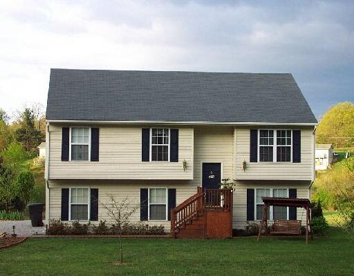 2485 Rutrough Road Southeast Roanoke, VA 24014 - Photo 1 of 1 a front view of a house with garden