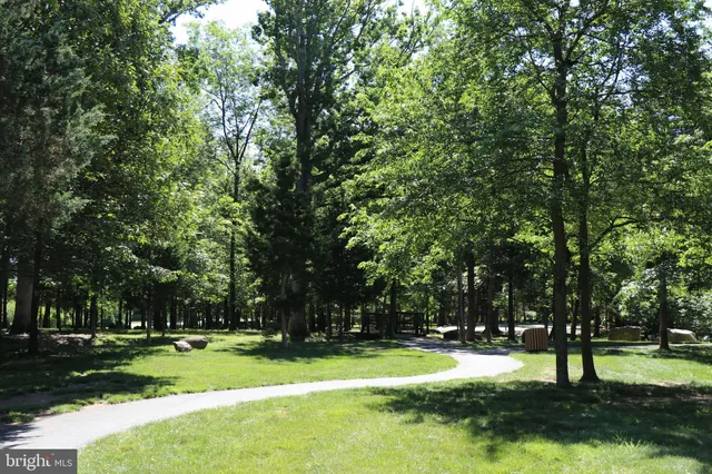 a view of a lake with houses in the back