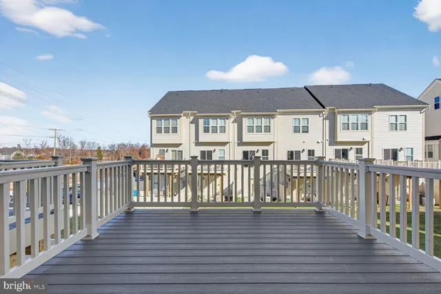 a view of a house with wooden deck