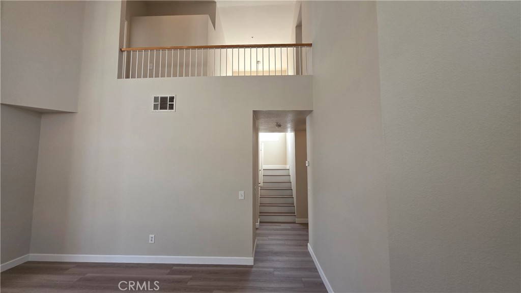 15577 Castellion Road Fontana, CA 92337 - Photo 21 of 38 Living room looking up to 2nd floor hallway
