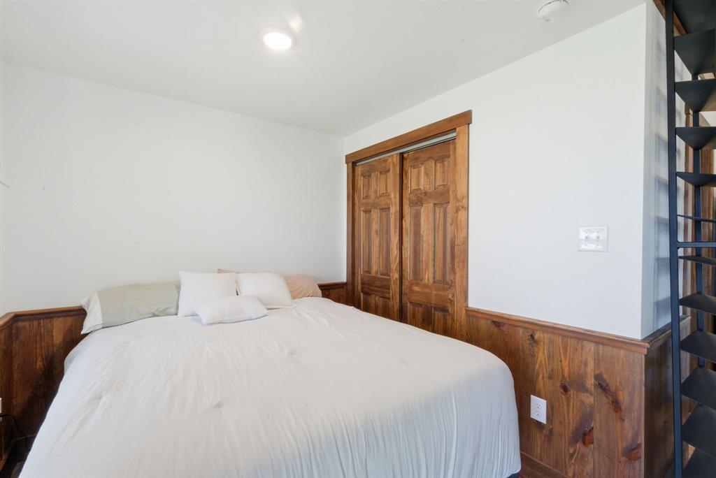 330 Chism Trail Gordon, TX 76453 - Photo 11 of 35 a bedroom with a bed and a window